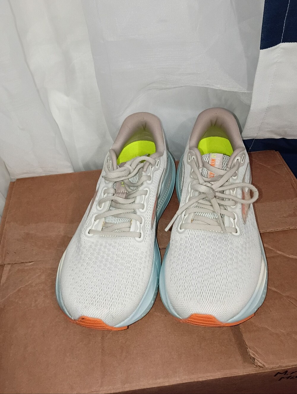 Brooks Women’s Light Gray Running Shoes with Blue Midsole and Orange Toe Accents